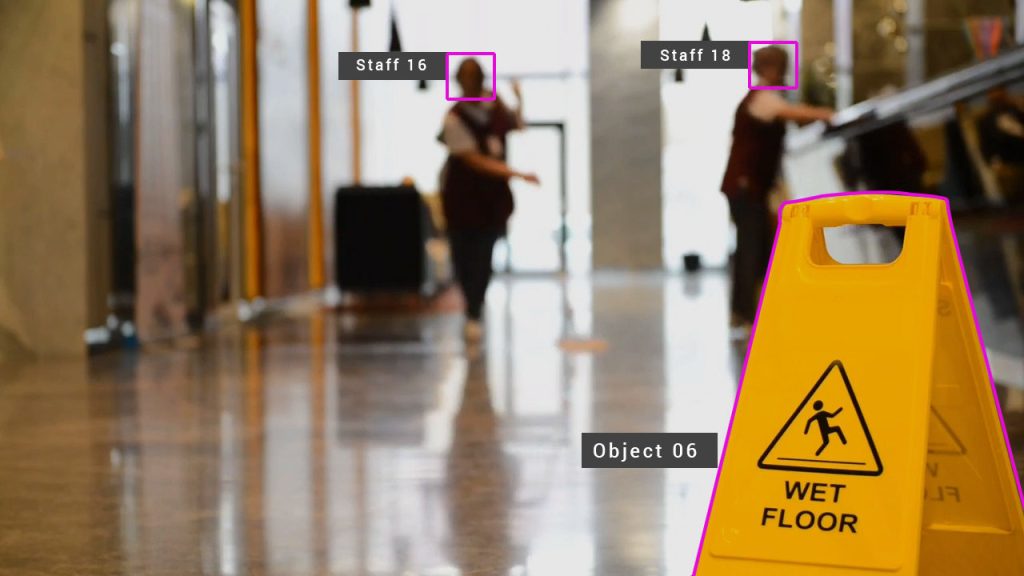 Wet floor sign with staff detected in hallway